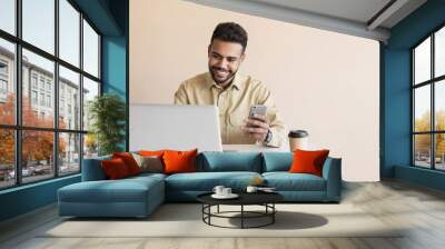 Young man student using laptop computer at home, studying online. Businessman working in office. Distance study, work from home, e-learning, business, creative occupation, meeting online Wall mural