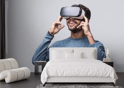 Young man using virtual reality headset. VR, future, gadgets, technology concept Wall mural