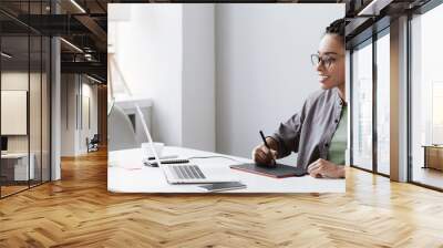 Young woman using laptop computer at office panoramic banner. Student girl working at home. Work or study from home, freelance, business, lifestyle concept Wall mural