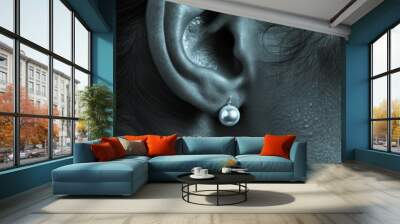 An ear sporting classic pearl earrings, set against a backdrop of a classic noir film scene, blending cinematic history with timeless fashion Wall mural