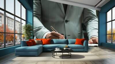 Envision a male CEO in a light grey suit, torso visible, pen in hand as if ready to sign a crucial deal Wall mural