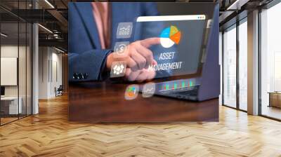 Asset management concept, Man using laptop with word asset management and Icon  on virtual display. Financial Property Digital assets. Wall mural