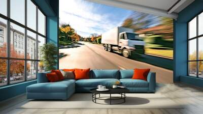 Transport truck speeding along a quiet suburban road, with motion blur creating a sense of urgency and efficiency in last-mile delivery services Wall mural