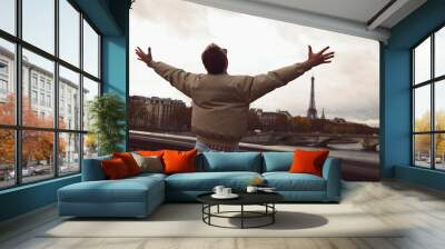 Handsome man enjoying in Paris. Wall mural