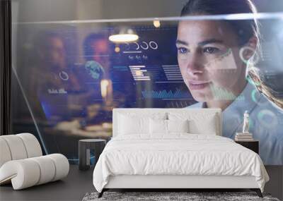 Portrait of a beautiful woman (girl) while she is looking at a futuristic screen with holograms and the office in the background. Concept: Future, Technology, work Wall mural