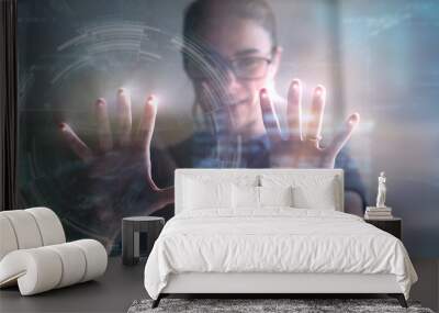 Portrait of an young man is using the futuristic latest innovation technology with augmented reality hologram.  Wall mural