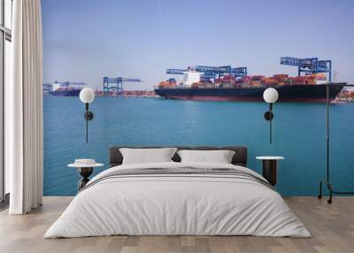 View of an industrial port where freight loads are carried for national and international shipping by sea or ocean on cargo ships. Concept of: transportation, ships, trade. Wall mural