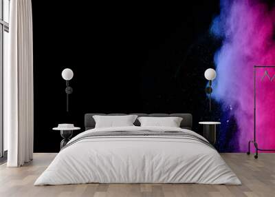 abstract colored dust explosion on a black background.abstract powder splatted background. Wall mural