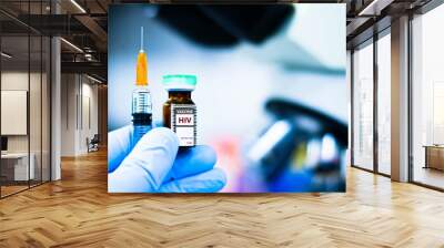 Vaccine bottles and syringes for preventing HIV. Wall mural