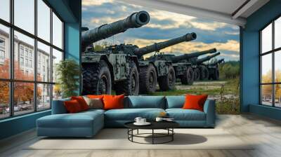 Heavy Artillery: A Row of Powerful Guns Await Their Orders, Ready to Strike. The Cloudy Sky Sets the Stage for a Tense Atmosphere. Wall mural