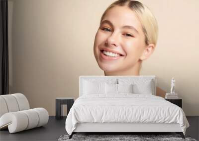 Beautiful smile of young woman with healthy white teeth on beige background, Dental care. Dentistry concept. Wall mural