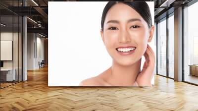 Beautiful smile young woman. White teeth on the master plan. Free space and white background Wall mural