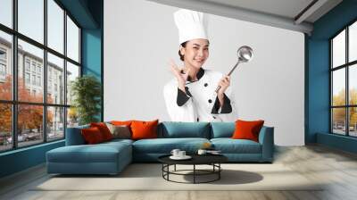 Beautiful young asian woman chef on white background Wall mural