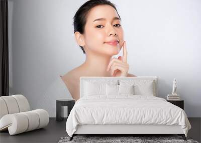 Beautiful Young Asian Woman with Clean Fresh Skin. Face care, Facial treatment, Cosmetology, beauty and healthy skin and cosmetic concept, woman beauty skin isolated on white background Wall mural