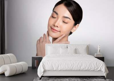 Close up Beautiful Young asian Woman touching her clean face with fresh Healthy Skin, on white background, Beauty Cosmetics and Facial treatment Concept Wall mural