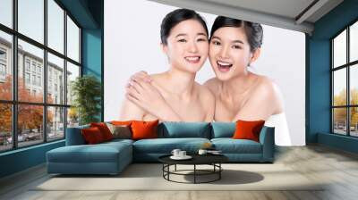 Portrait Two beautiful young asian woman clean fresh bare skin concept.  Asian girl beauty face skin care and health wellness, Facial treatment, Perfect skin, Natural make up, on white background Wall mural