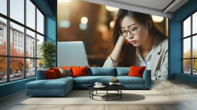 asian businesswoman working in the office with eye strain from the computer Wall mural