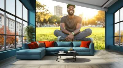 Discover urban tranquility: cheerful man enjoys a sunny day at the park, embracing outdoor relaxation and city life bliss. Wall mural