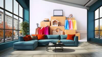 Colorful shopping bag with stack of cardboard boxes and fashion items at home, Website online shopping concept with copy space Wall mural