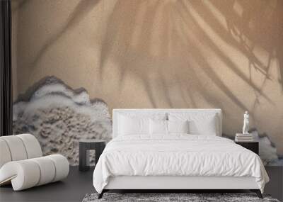 Soft ocean wave on a tropical sandy beach with palm leaves shadow in the summer Wall mural