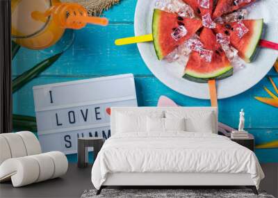 Women's casual clothes with accessories items and tropical fruits and flowers on white wooden background, I love summer concept Wall mural