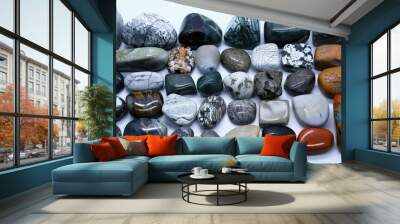 Studio photo featuring a collection of various types of stones arranged in an artistic manner Wall mural