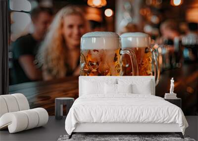 two large mugs of foamy Oktoberfest beer on sunny bar counter, blurred background, munich carnival Wall mural