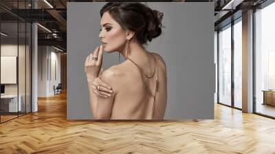 Beautiful female model with jewellery on back Wall mural