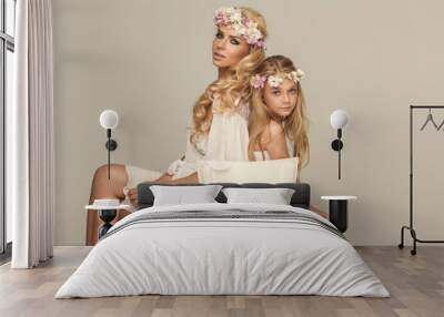 Beautiful mother and daughter with wreath Wall mural