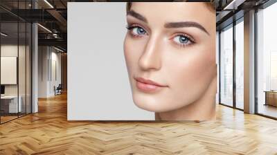 Beauty portrait of female face with natural clean skin Wall mural