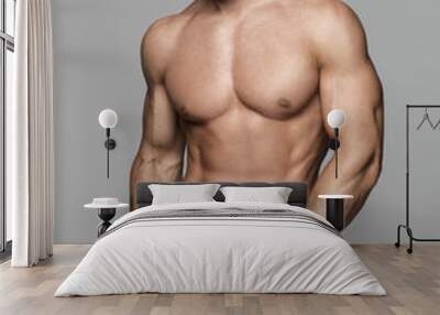 Fitness male model posing Wall mural