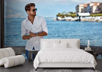 Handsome man in summer outfit wear sunglasses Wall mural