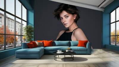 Portrait of a young beautiful brunette girl with short stylish hair Wall mural