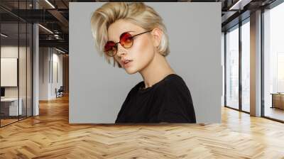 Portrait of blond woman in retro sunglasses Wall mural