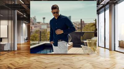 Portrait of handsome man wear summer outfit Wall mural