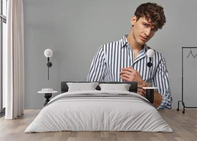 Portrait of hansome man wear striped shirt in black and white Wall mural