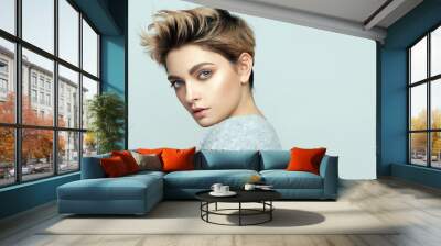 Portrait of sexy young woman with short hair isolated on gray background Wall mural