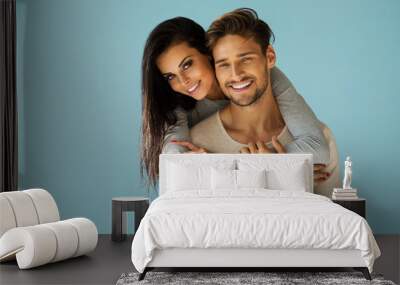 Portrait of smiling beautiful couple Wall mural