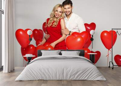 Valentine's photo of young loving couple with balloons heart Wall mural