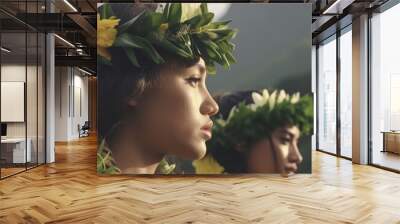 A portrait of two Polynesian women wearing leis and gazing out over an island mountain range  Wall mural