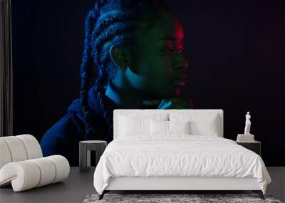 Colorful portrait of thoughtful cool woman with dark skin and braided hair Wall mural