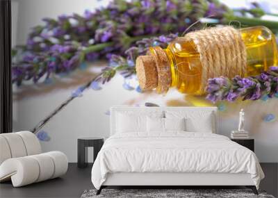 Lavender oil and lavender flowers on white background Wall mural