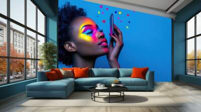 Vibrant Woman with Colorful Face Painting and Phone Wall mural