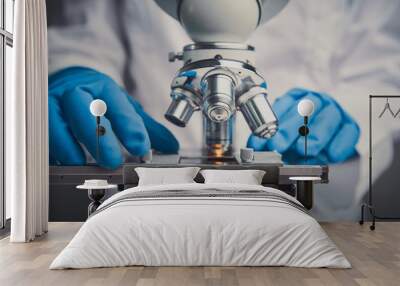 Close-up shot of microscope with metal lens. Wall mural