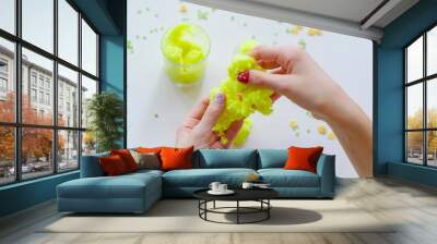 a child playing with snowy yellow slime Wall mural