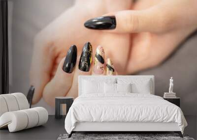 elegant female hands with long nails after procedure manicure in a beauty salon Wall mural