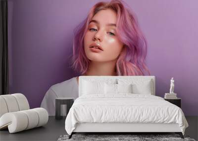 20 years old girl  with pastel mauve hair looking serene on a lavender background Wall mural