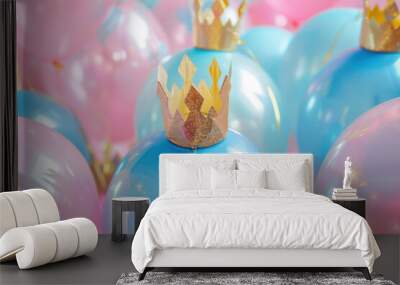 blue  and pink party balloons decorated with golden crowns for festive occasions Wall mural