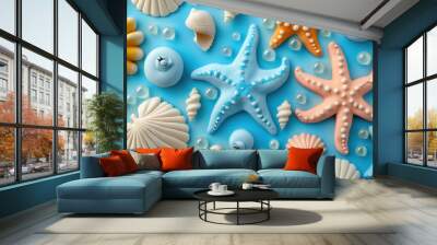 creative sea theme with fondant starfish and shells on blue background Wall mural