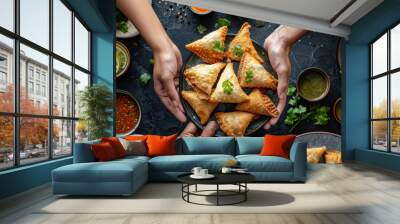 homemade golden samosas presented in a bowl by a woman, traditional ramadan food  Wall mural